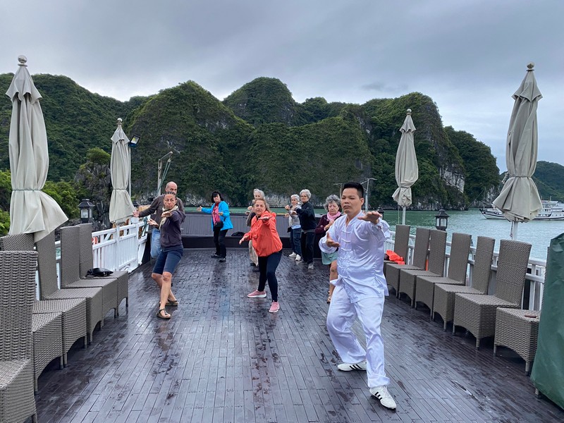 Tai Chi practice on Halong Bay for health improvement.